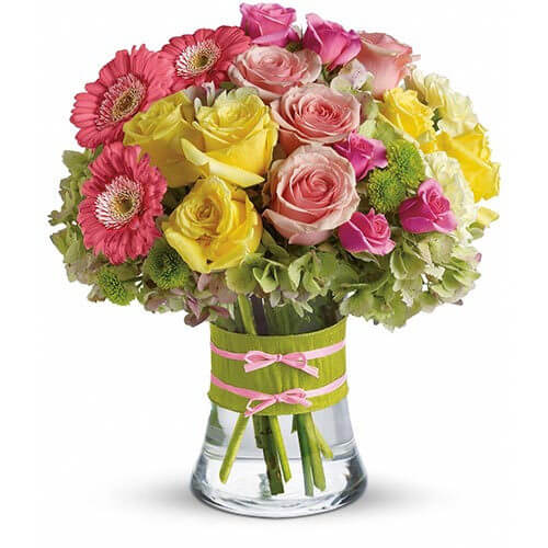 floral fashionista flower arrangement mini pink gerberas, hydrangea, and yellow and pink roses, accented by charming button mums