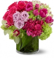 Love Always flower arrangement with two colors of roses, exotic orchids, glossy tulips, and hydrangea, this bouquet is a vibrant mix of vibrant pink, lavender, and chartreuse.