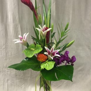 Splendid Tropical flower arrangement with Anthurium, Ginger, Lilies, Orchids, and Roses