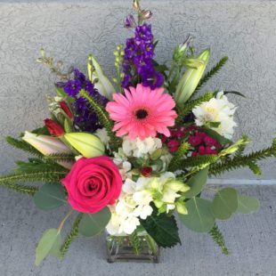 Sweet Moments Flower arrangement - Daisies, Hydrangea, Larkspur, Lilies, and Roses