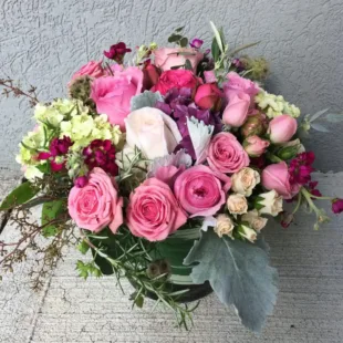 Abundant Love Bouque Flower Arrangementwith assortment of carnations, hydrangea, roses, spray roses, and stock