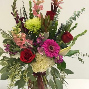 Flower Arrangement from Artistic Flowers and Home Decor - Picture of roses, carnations, and other flowers arranged together
